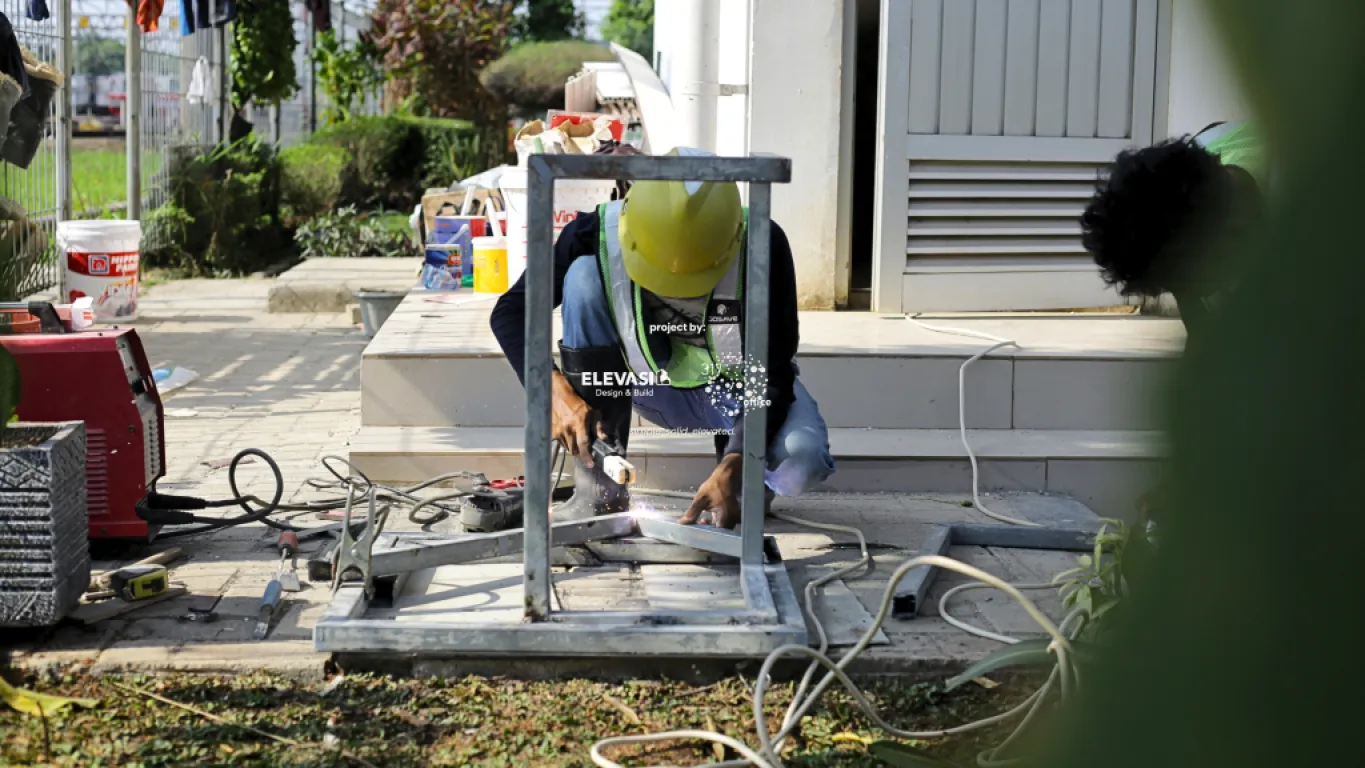 Construction workers welding on-site